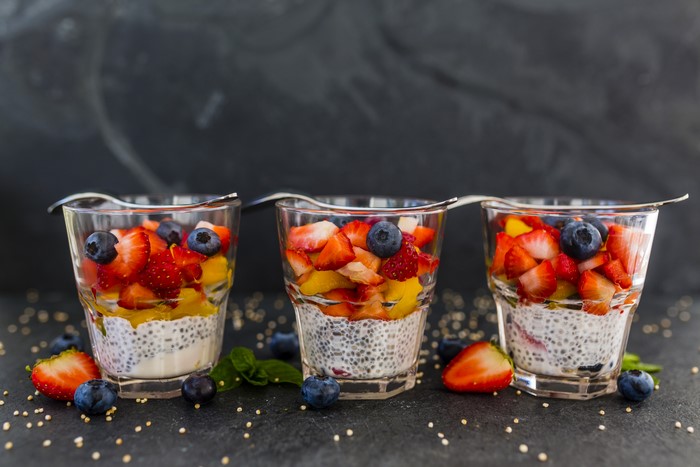 Three glasses of chia pudding with fruit