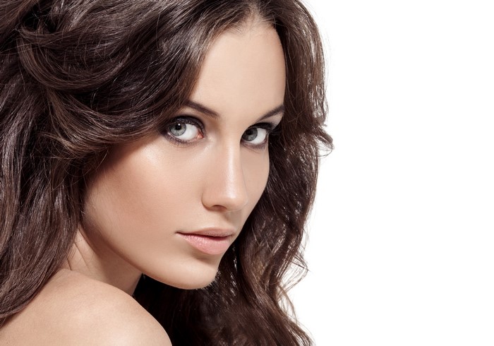 Beautiful woman with brown hair and makeup