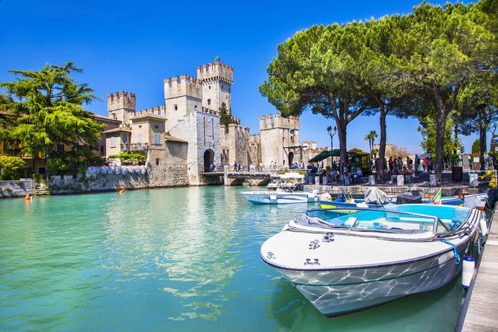 Scaliger Castle on Lake Garda, Italy with Motorboats