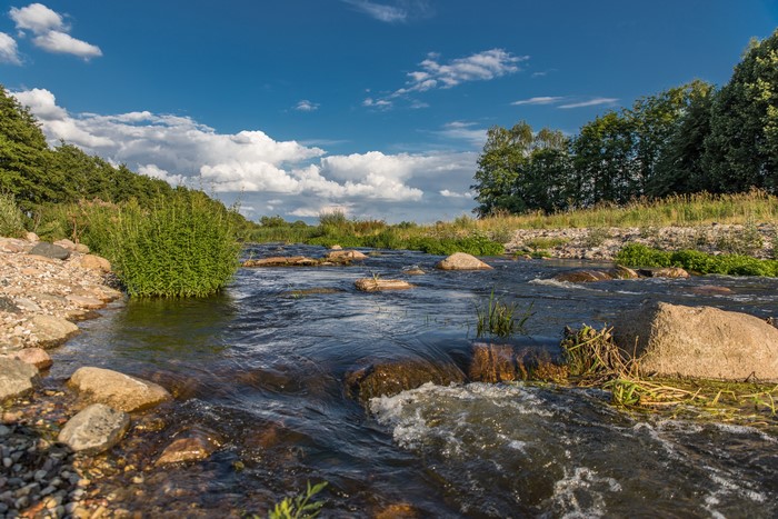 River flowing over stones in Parum, Germany