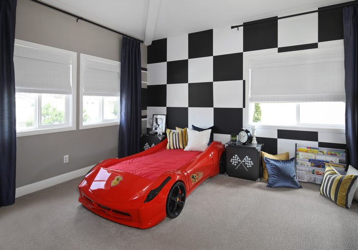 Children's bedroom with race car bed and checkered wall