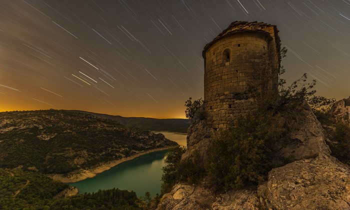 4K La Pertusa Spain Night Star Trails Over River and Hill