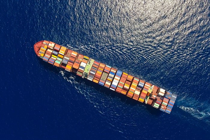 Aerial View of a Colorful Container Ship at Sea