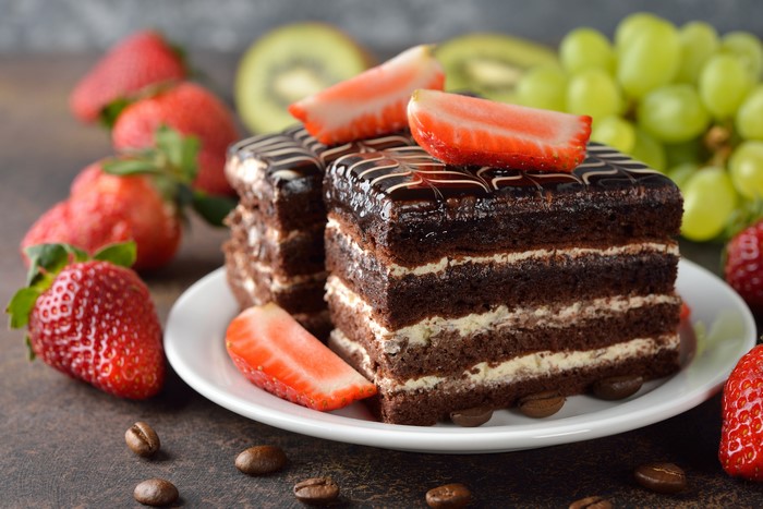 Chocolate cake with strawberries and coffee beans