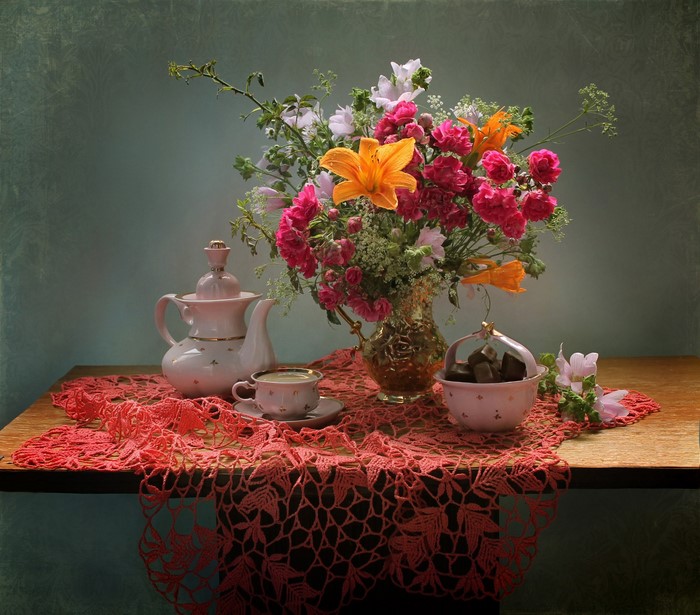 Still-life with bouquet, tea set, and candies