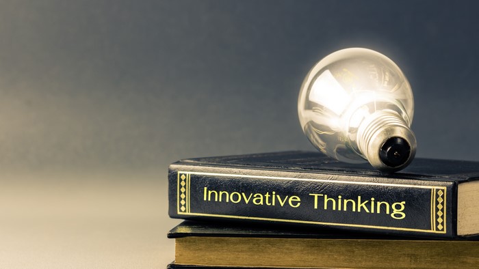 Light bulb on book titled Innovative Thinking
