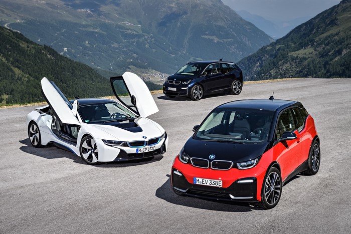 Three BMW electric cars on a mountain road