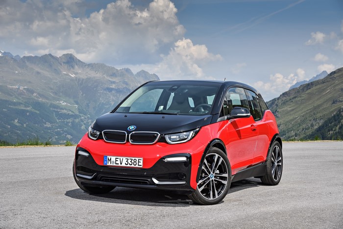 Red BMW i3 with Mountains in Background