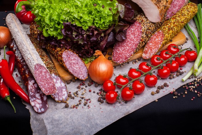 Meat products, sausages, tomatoes, vegetables, onion, spices