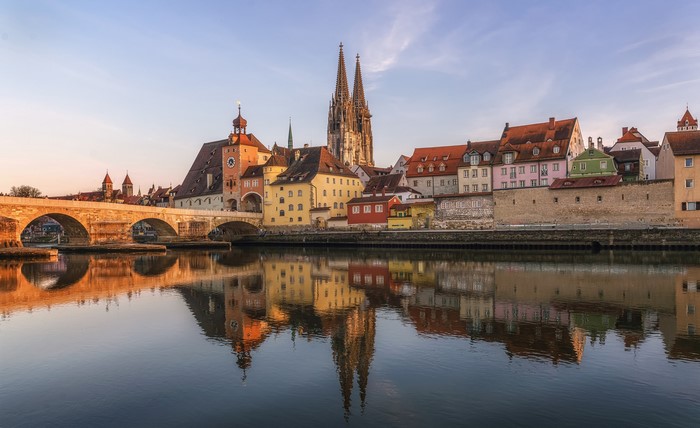 Regensburg, Germany: Old Bridge and Historic Buildings Reflected in River
