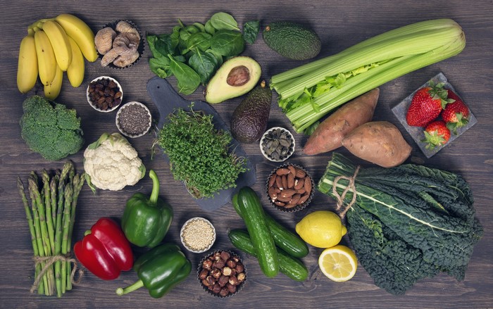 Assortment of Fresh Fruits and Vegetables on Wooden Surface