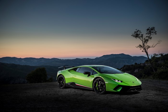 Green Lamborghini Huracan Performante on a hill