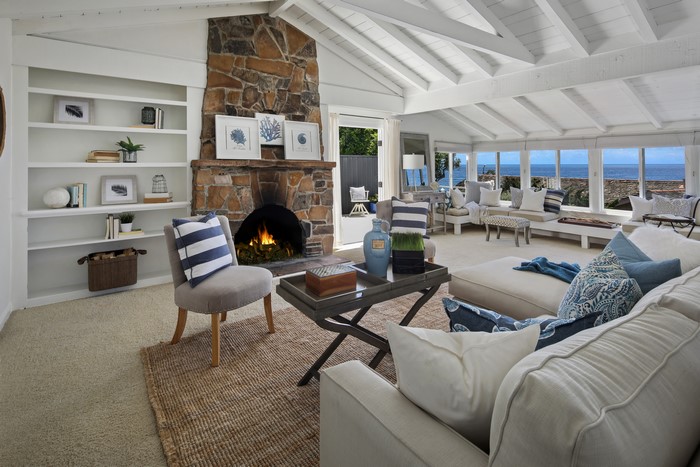 Living room with fireplace and ocean view