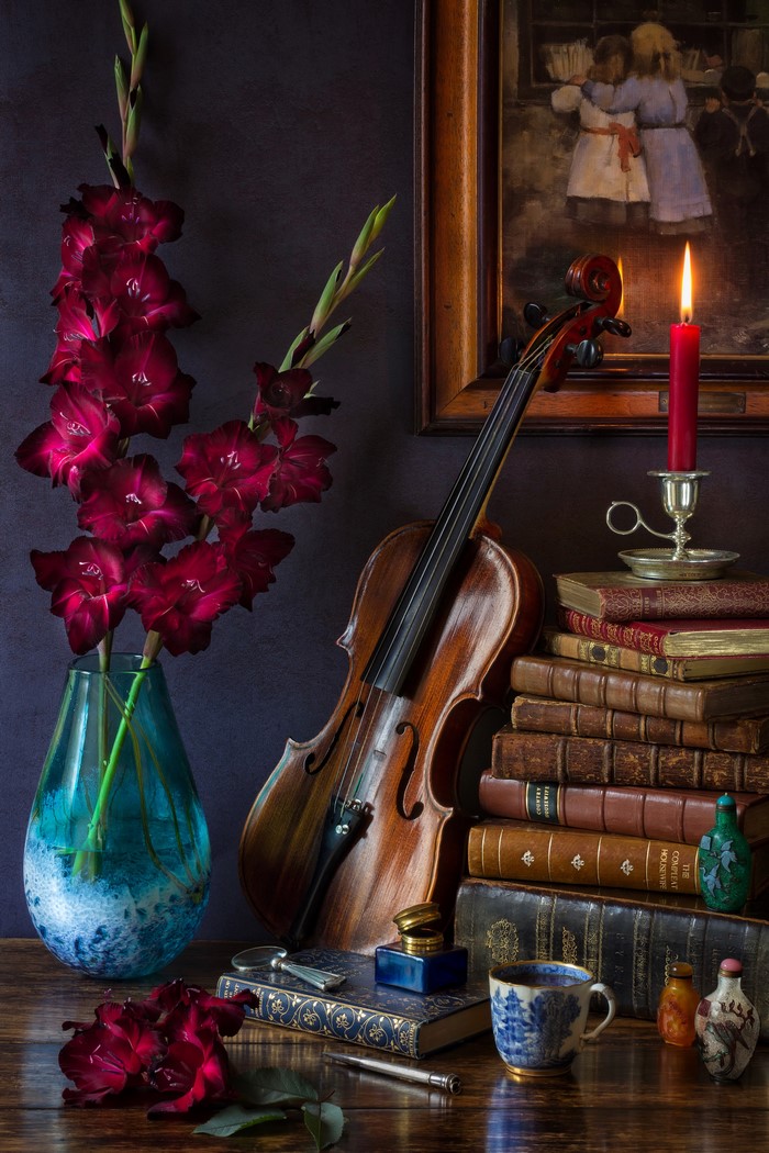 Still-life with gladioluses, violin, books, and candle