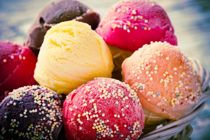 Assortment of colorful ice cream scoops with sprinkles