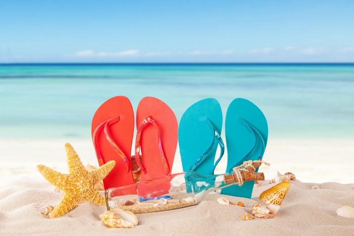 Flip-flops, Starfish, and Message in a Bottle on Beach
