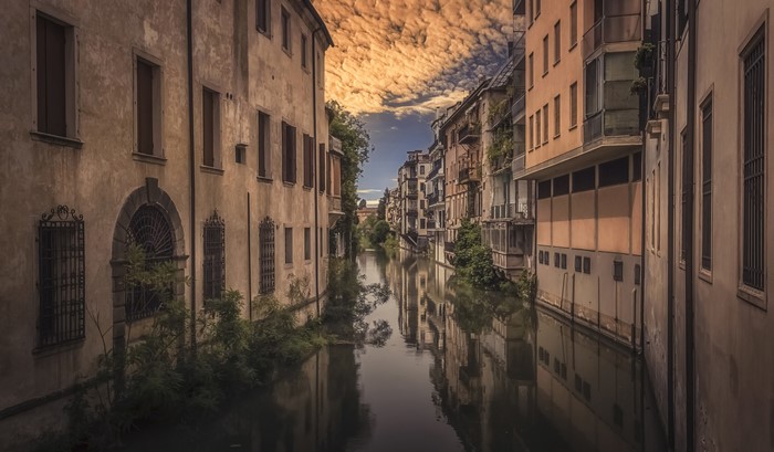 Canal in Padova, Italy with old houses