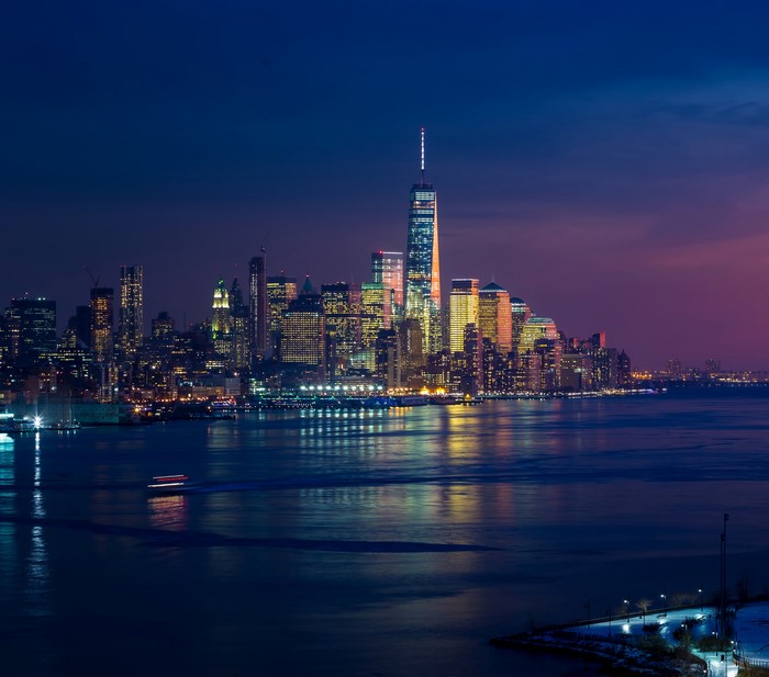 New York City skyline at dusk with One World Trade Center