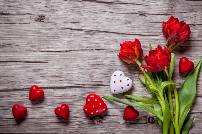 Red Tulips and Hearts on Wooden Background