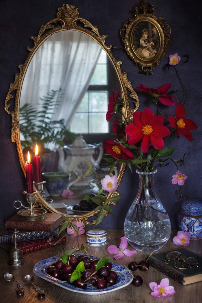 Still-life with cherries, candles, and mirror