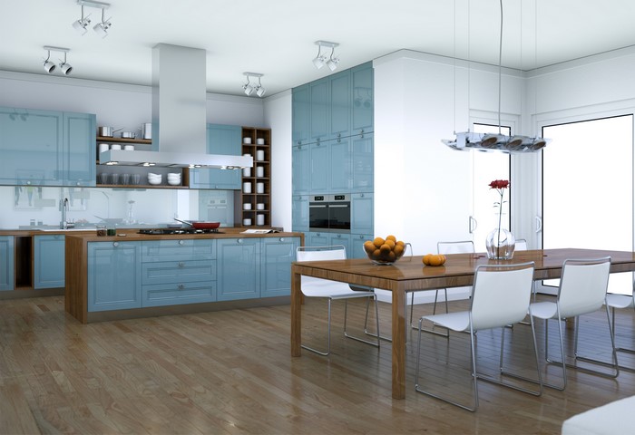 Modern blue kitchen with dining table and chairs