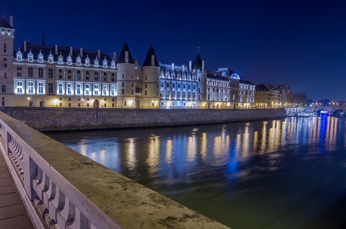 Palace on the Seine River at Night in Paris