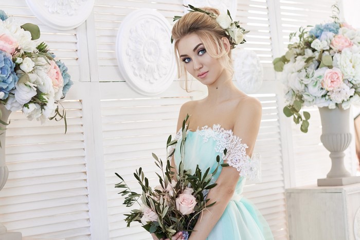 Bride with bouquet and flowers