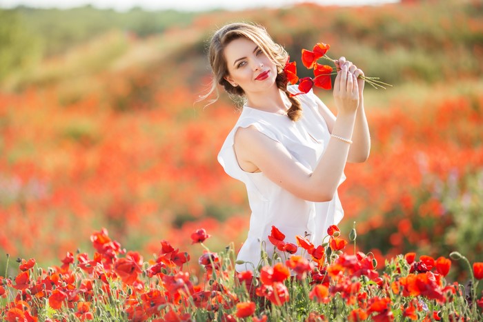 Woman in a poppy field