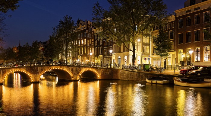 Amsterdam Canal Bridge at Night with Houses and Boats