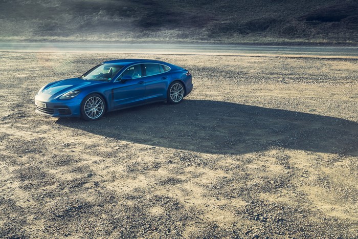 Blue 2016 Porsche Panamera 4S on gravel
