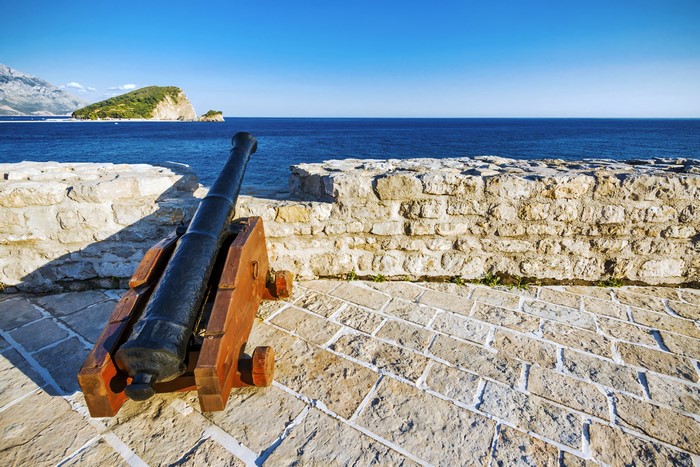 Cannon on stone wall overlooking the sea in Budva, Montenegro
