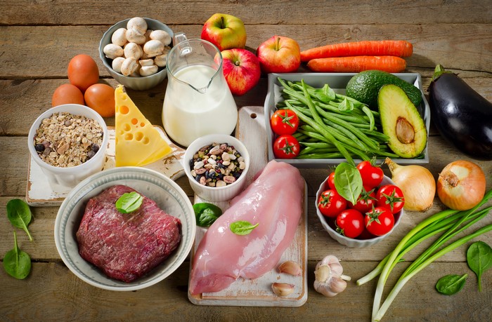 Assortment of Healthy Foods on Wooden Table