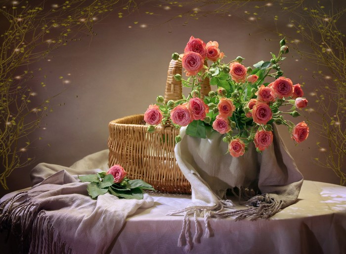 Pink roses in a wicker basket with a scarf
