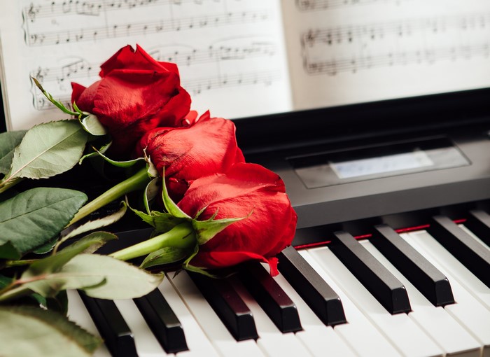 Red Roses on a Piano with Sheet Music