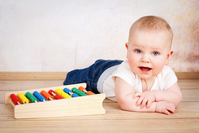 Baby with abacus toy