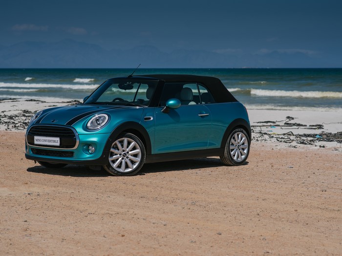 Teal Mini Cooper Convertible on a Beach