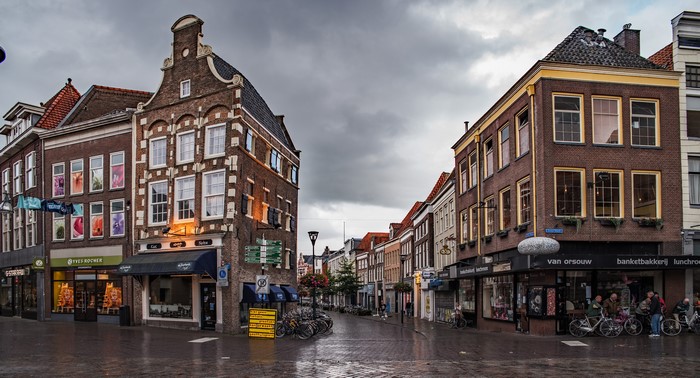 Street scene in Zwolle, Netherlands with historic buildings and bicycles