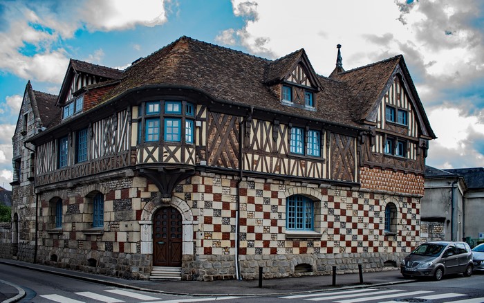Half-timbered house with checkered facade in Pont-Audemer, Normandy, France