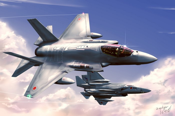 Two Japanese F-35J ASDF-X1 fighter jets flying in the sky