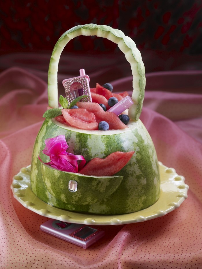 Watermelon handbag filled with fruit and accessories