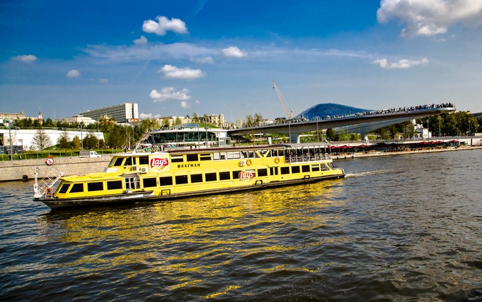 Yellow riverboat on Moscow River near Zaryadye Park