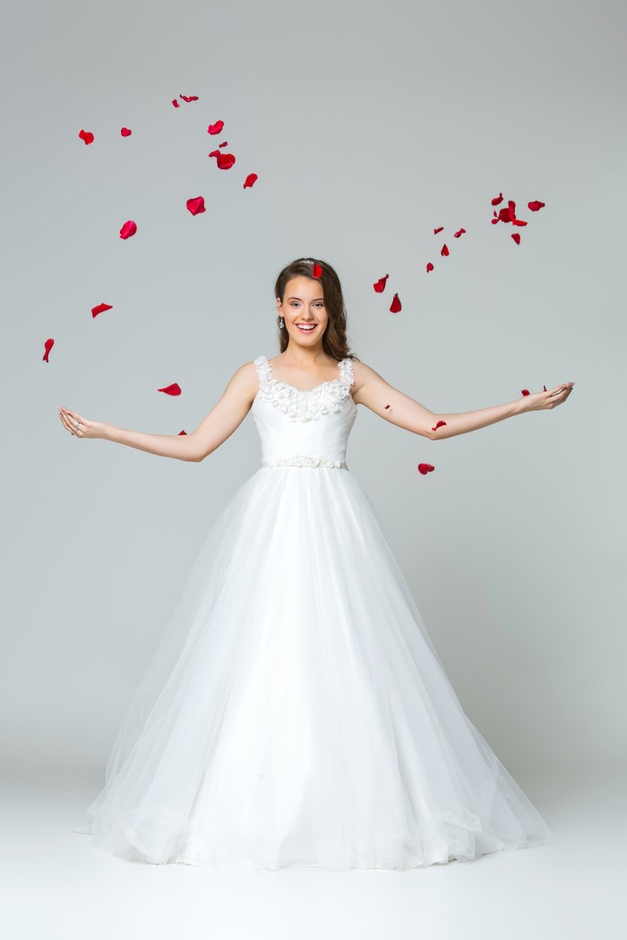 4K Bride in White Dress with Red Petals