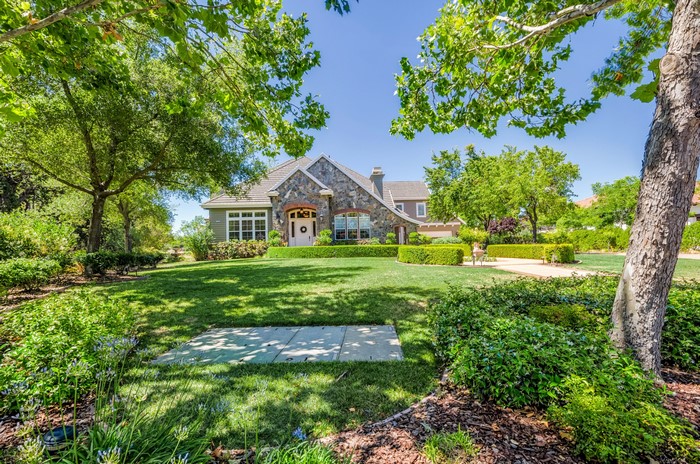 House in Pleasanton, California with manicured lawn and trees