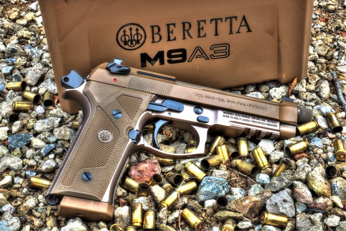 Beretta M9A3 pistol with spent casings