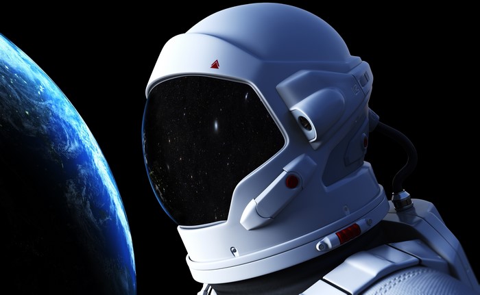 Astronaut in a helmet with Earth in the background