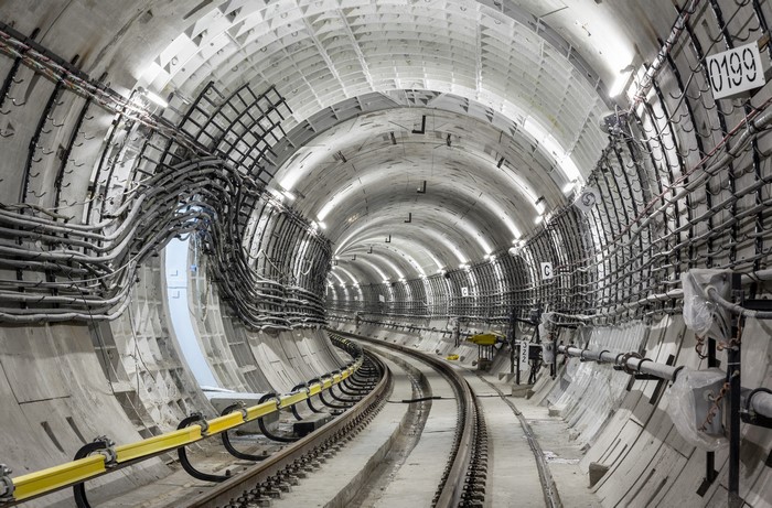 Railroad tunnel construction with cables and tracks