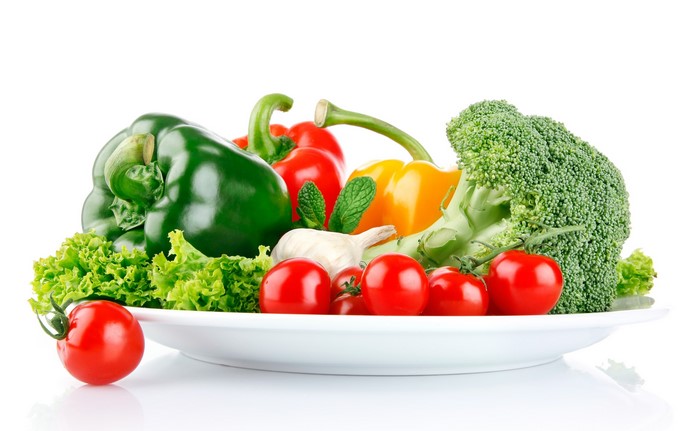 Assortment of fresh vegetables on a white plate