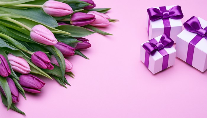 Pink and purple tulips with gift boxes