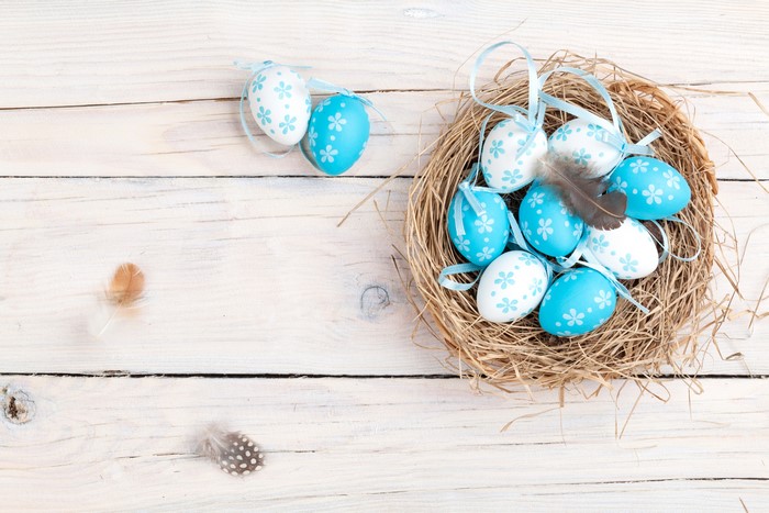 Easter Eggs in a Nest on Wood Planks