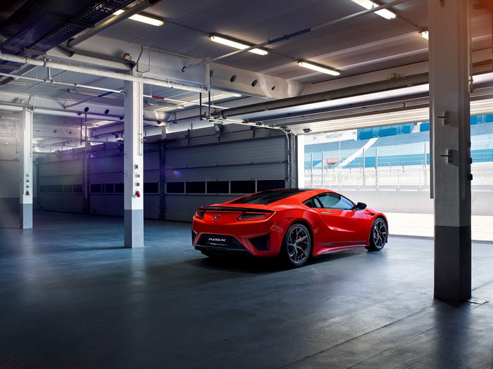 Red Acura NSX in a garage